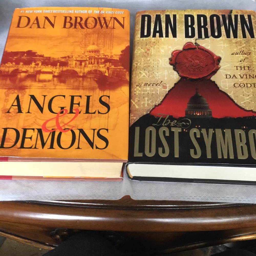 Dan Brown two hard cover books: “Angels & Demons,” and “The Lost Symbol”